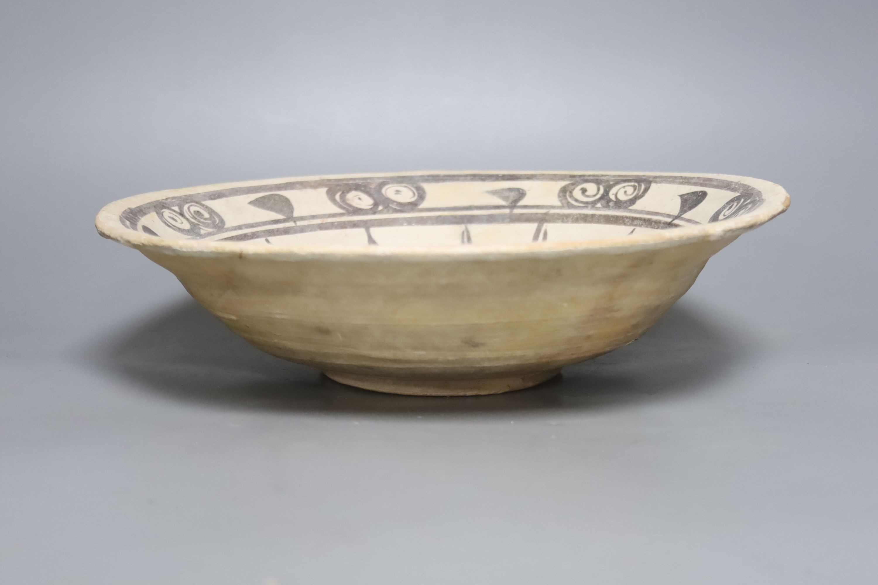 A Persian shallow bowl, medieval, diameter 30cm